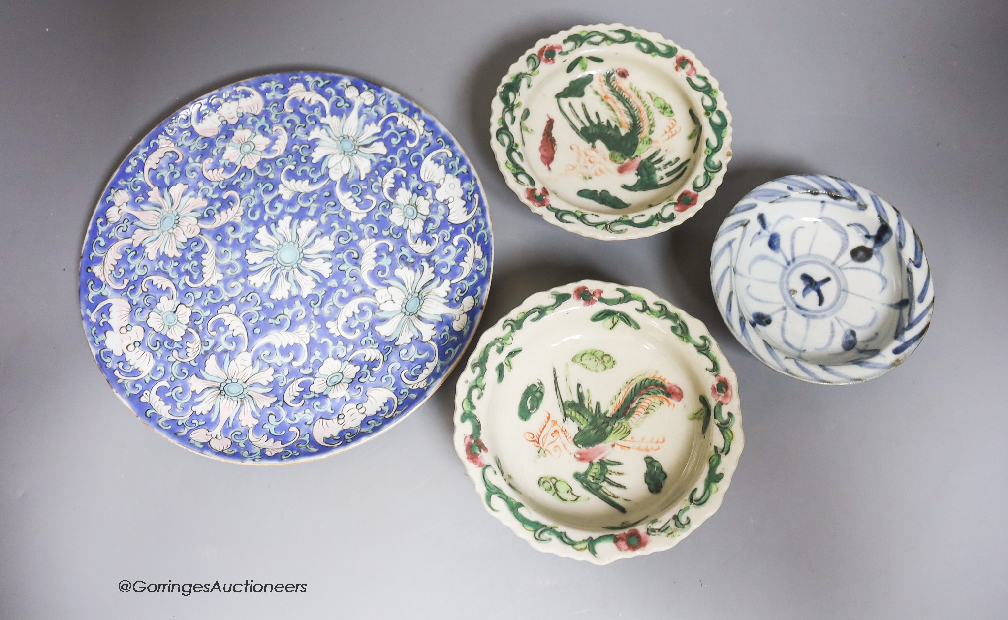 A pair of Chinese stem dishes, a blue-and-white stem dish and a 19th-century Chinese enamelled dish, diameter 21cm